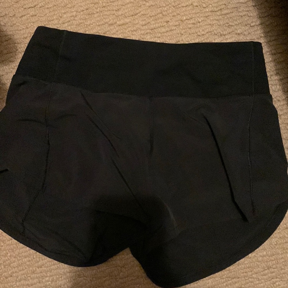 Selling size 2 black lululemon mid rise speed up shorts.